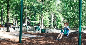 boy on a swing in a park